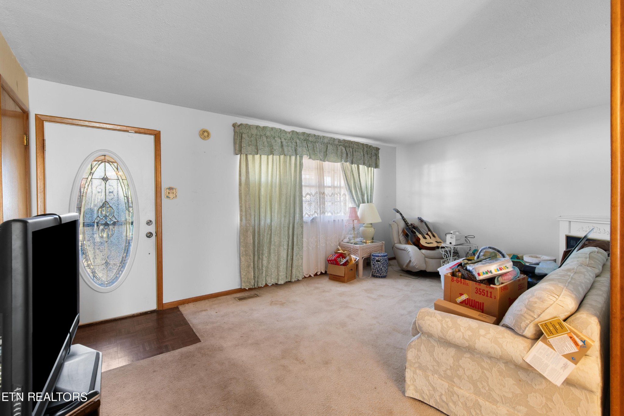 129 Peterson Road Knoxville, TN 37934 - Photo 17 of 24 a living room with furniture a window and gym equipment