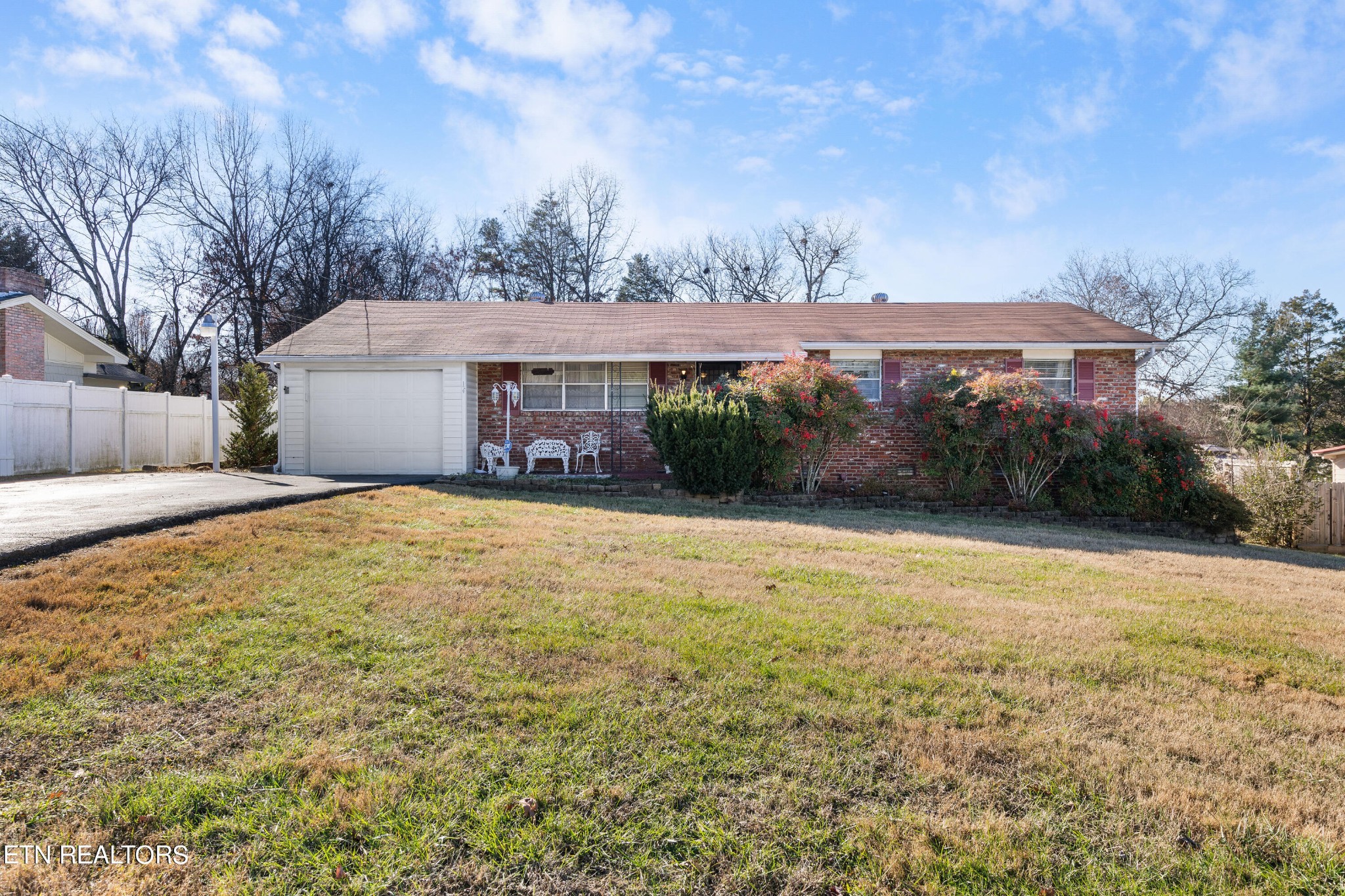 129 Peterson Road Knoxville, TN 37934 - Photo 2 of 24 a front view of house with yard and trees in the background