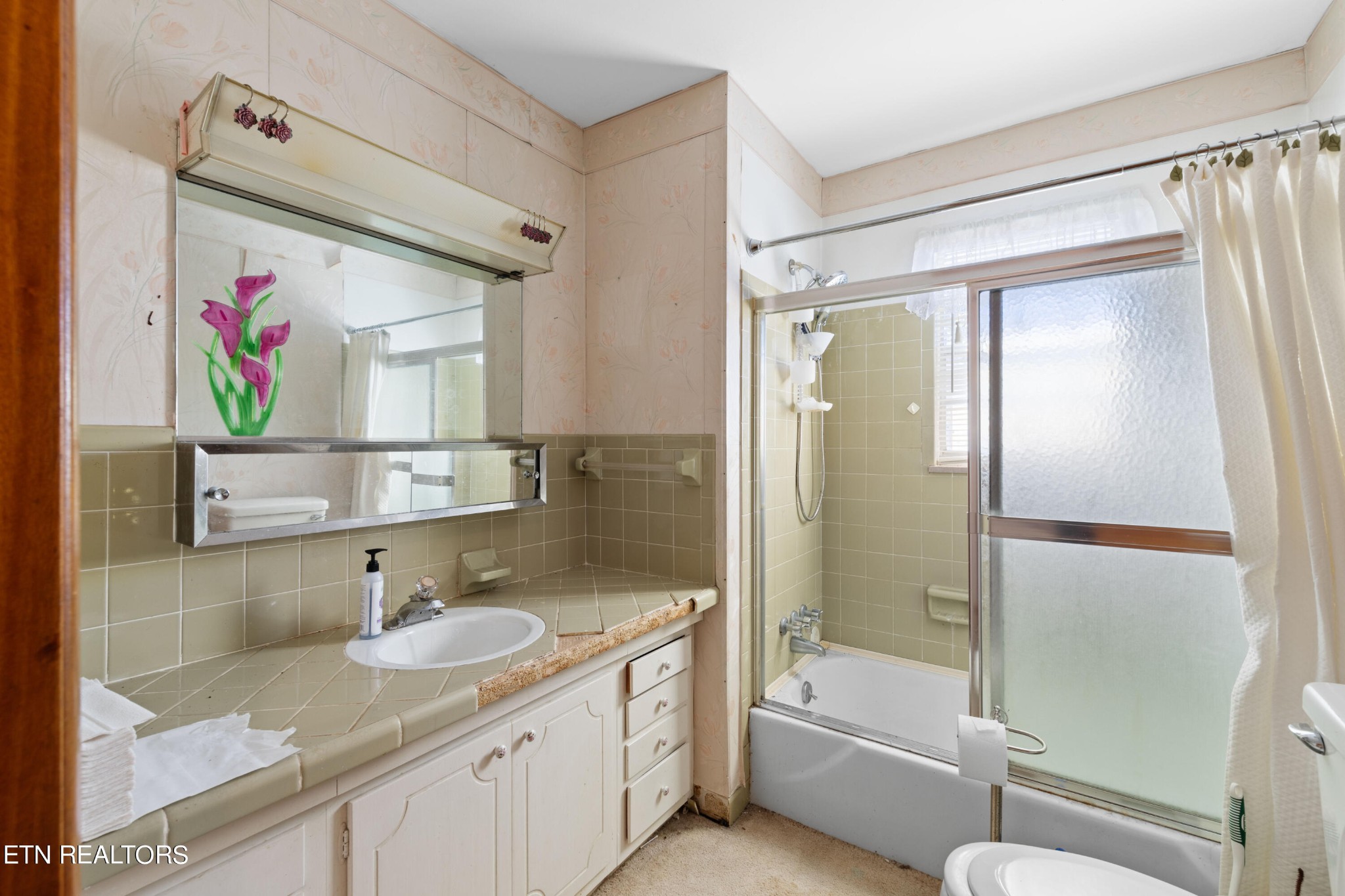 129 Peterson Road Knoxville, TN 37934 - Photo 9 of 24 a bathroom with a granite countertop sink mirror toilet and bathtub
