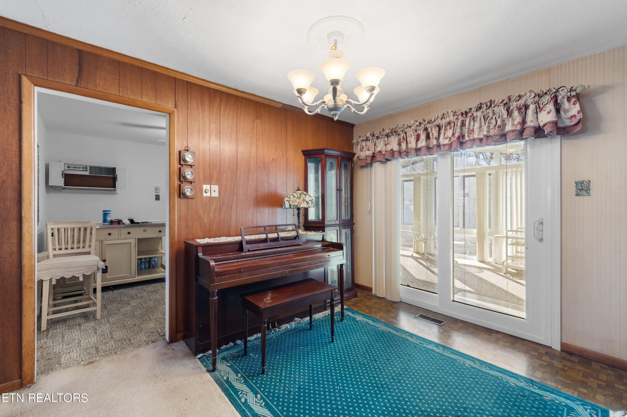129 Peterson Road Knoxville, TN 37934 - Photo 10 of 24 a living room with furniture and a chandelier