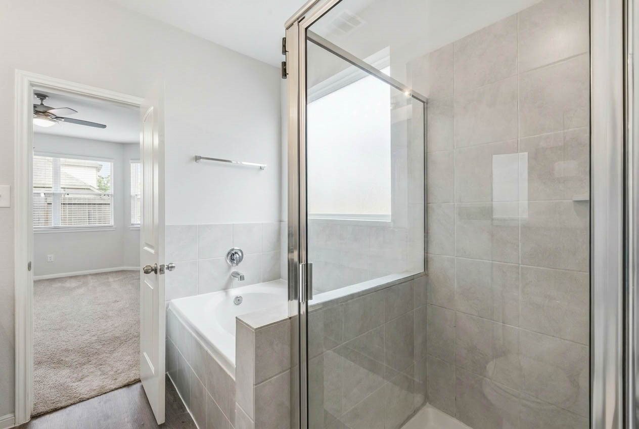 5018 Yello Ginko Trail Spring, TX 77373 - Photo 11 of 24 Walk-in shower + soaking tub for a spa-like feel.