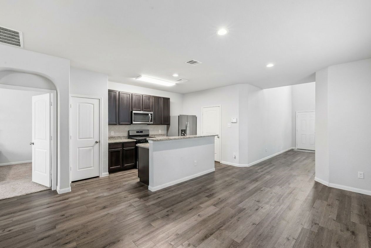 5018 Yello Ginko Trail Spring, TX 77373 - Photo 2 of 24 An airy open-concept design defines the first floor, seamlessly connecting living, dining, and kitchen spaces for effortless everyday living and entertaining.