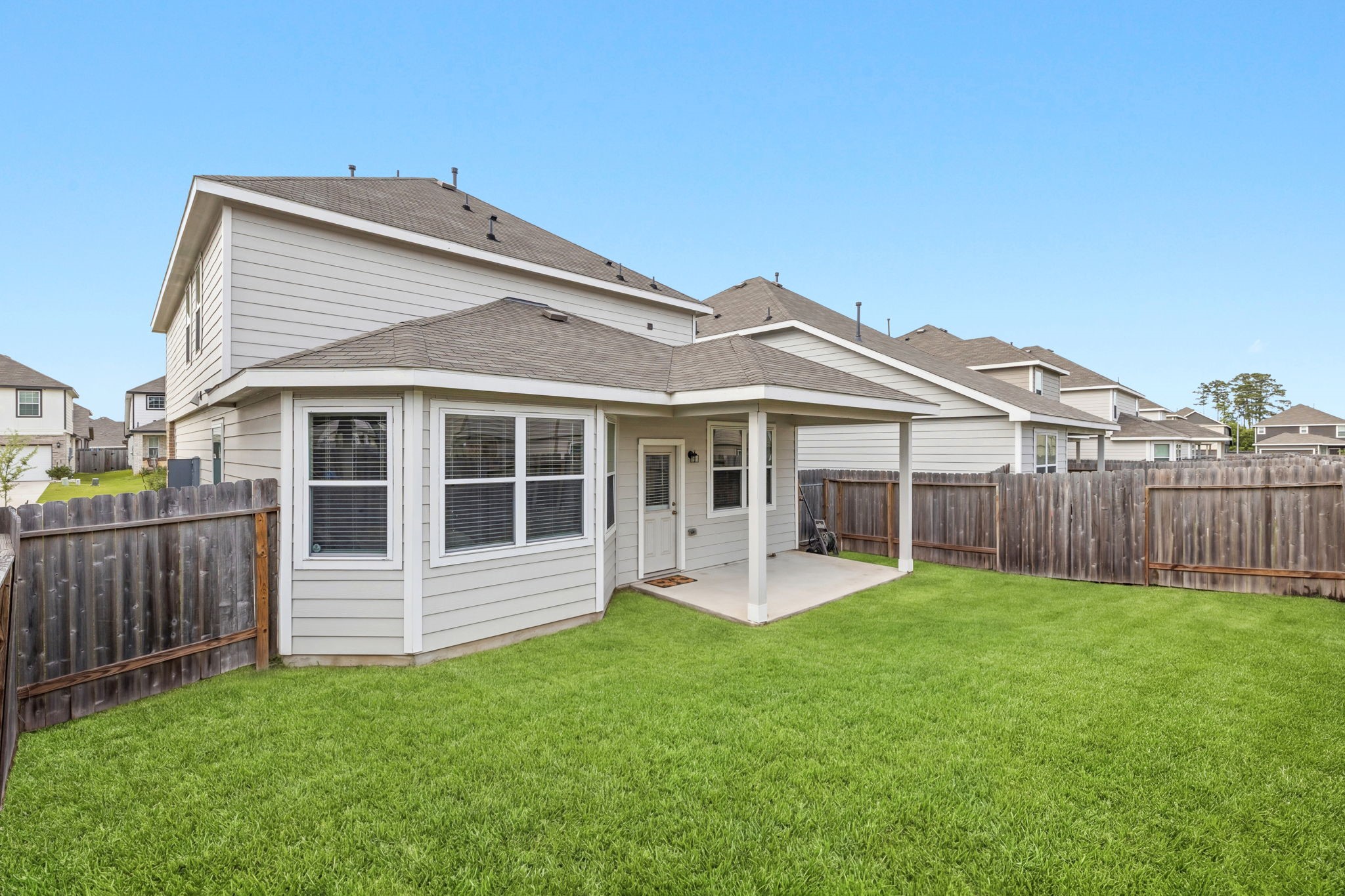 5018 Yello Ginko Trail Spring, TX 77373 - Photo 22 of 24 Spacious backyard with a covered patio for outdoor enjoyment!