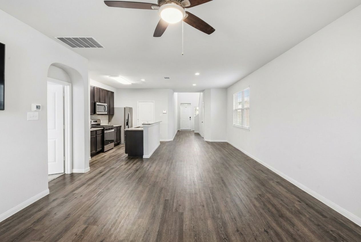 5018 Yello Ginko Trail Spring, TX 77373 - Photo 5 of 24 Effortless flow connects the kitchen, living, and dining spaces, perfect for hosting.