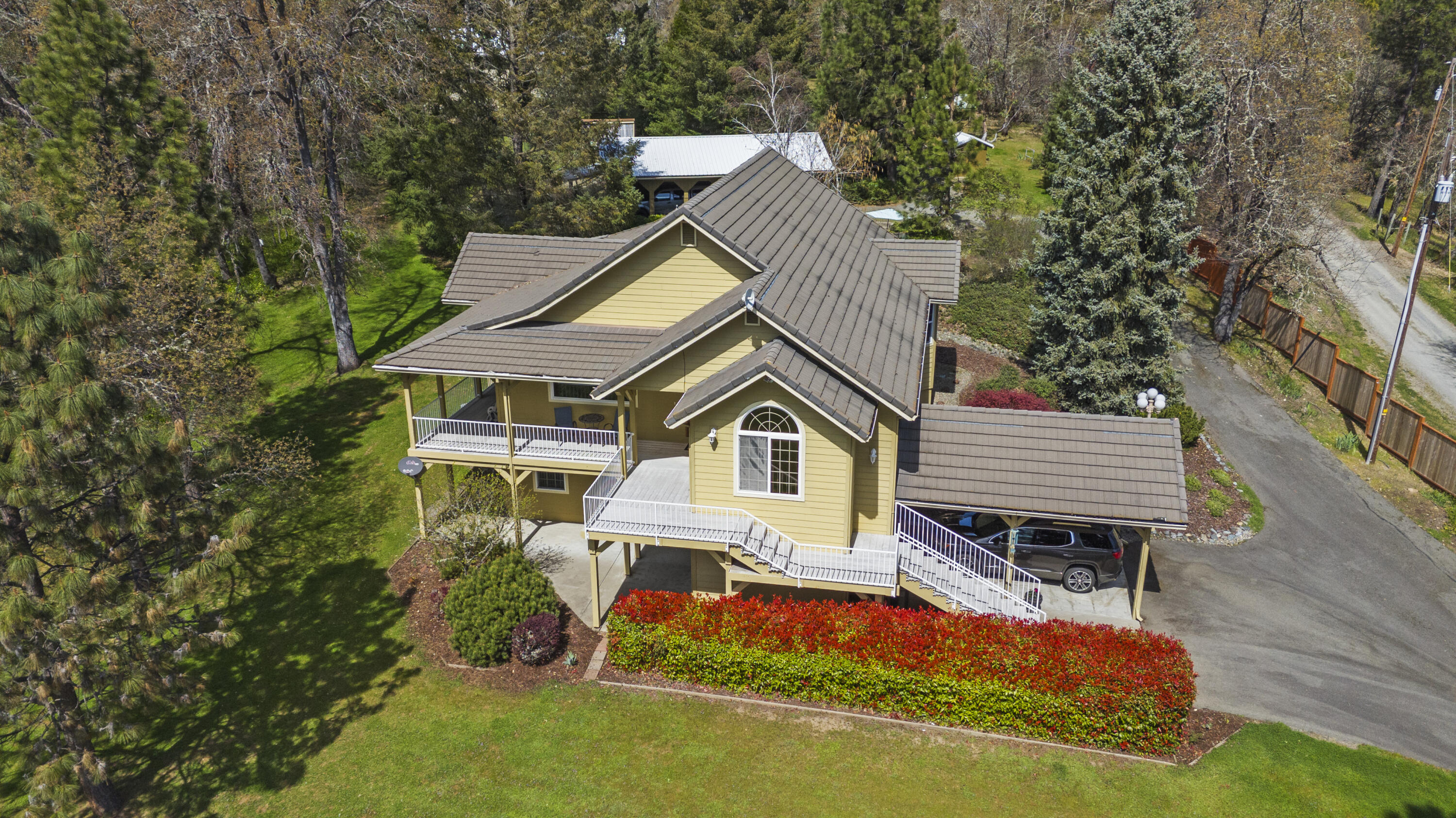4874 Upper River Road Grants Pass, OR 97526 - Photo 2 of 66 a house view with a garden space