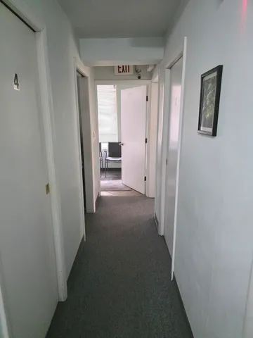 a view of a hallway with workspace