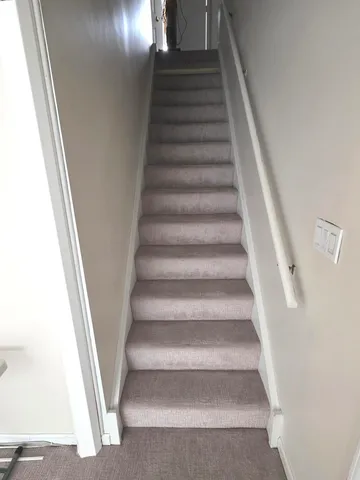 a kitchen with a stove top oven and cabinets