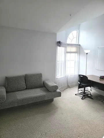 a view of a hallway with closet