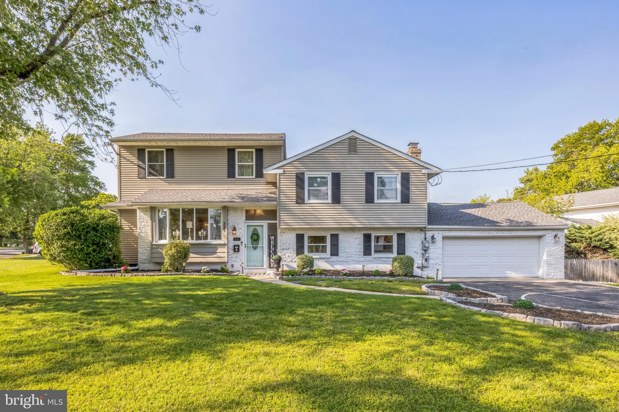 333 Farmdale Road Moorestown, NJ 08057 - Photo 1 of 45 a front view of a house with a yard table and chairs