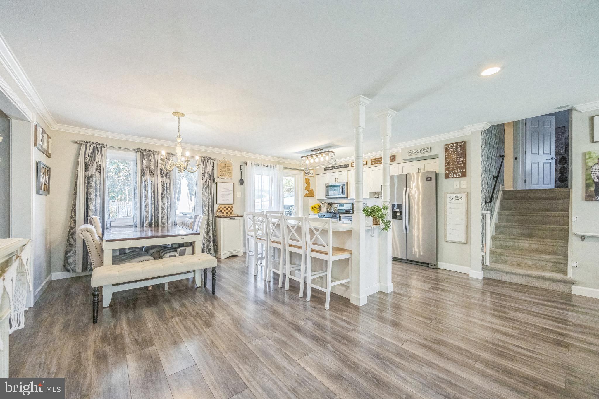 333 Farmdale Road Moorestown, NJ 08057 - Photo 14 of 45 a living room with wooden floors furniture and a large window