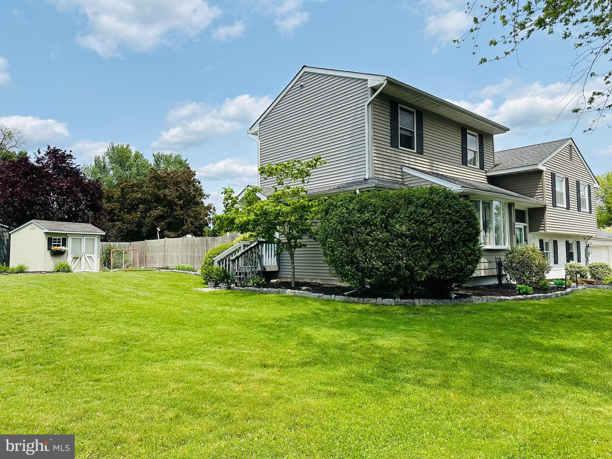 333 Farmdale Road Moorestown, NJ 08057 - Photo 2 of 45 a front view of a house with a yard