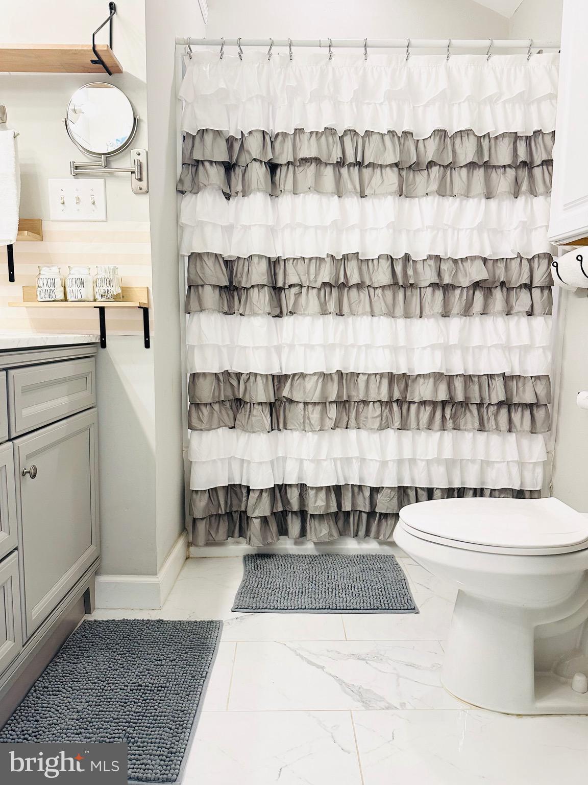 333 Farmdale Road Moorestown, NJ 08057 - Photo 28 of 45 a bathroom with a sink a toilet and shower curtain