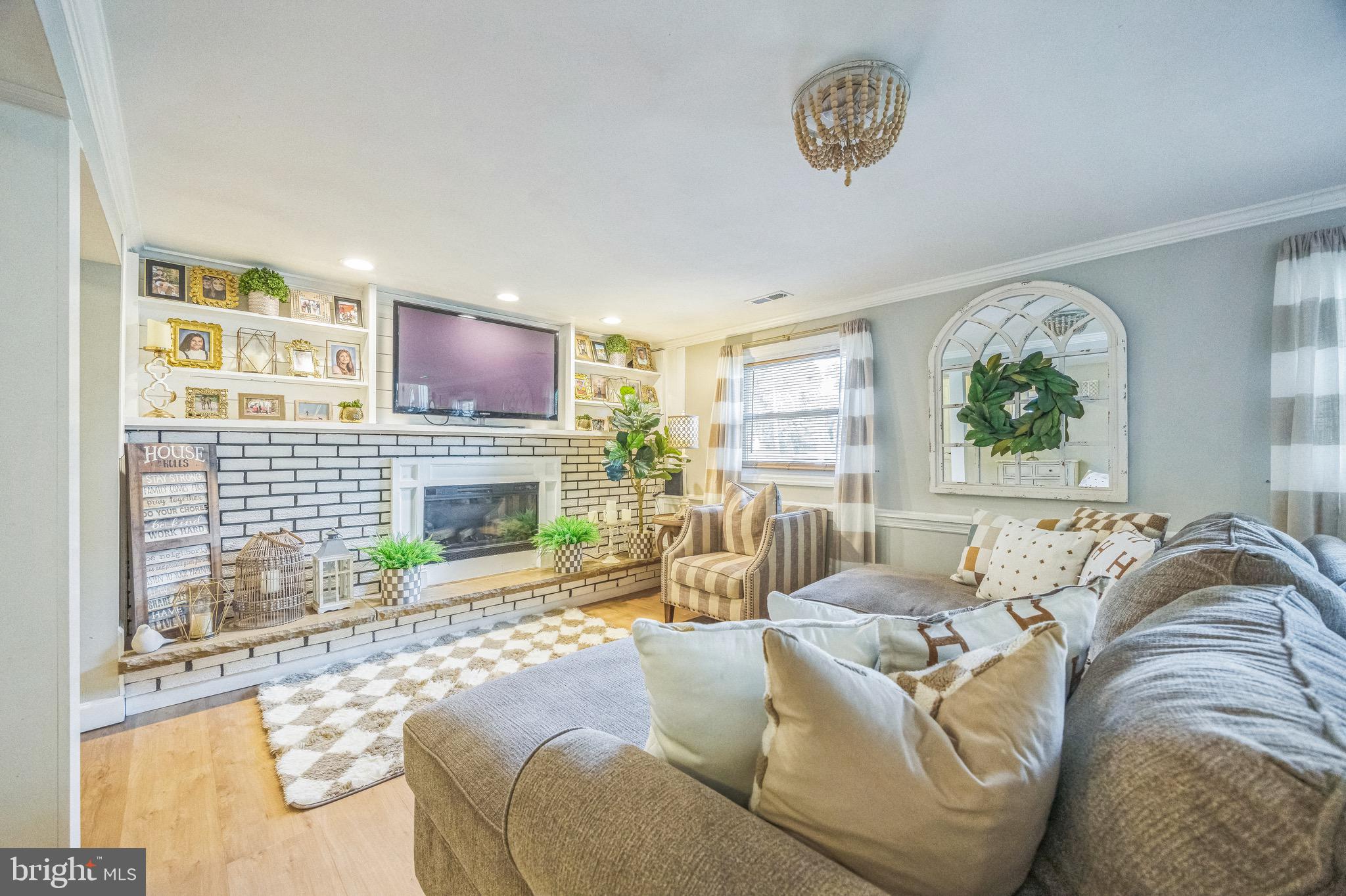 333 Farmdale Road Moorestown, NJ 08057 - Photo 32 of 45 a living room with furniture and a fireplace