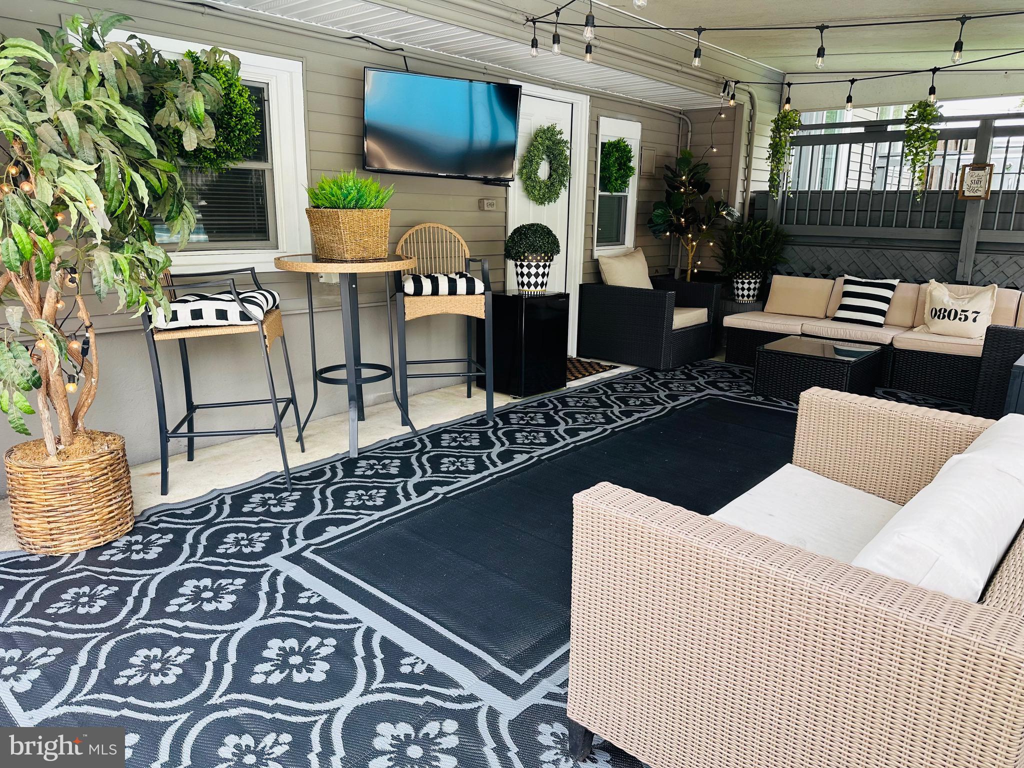 333 Farmdale Road Moorestown, NJ 08057 - Photo 40 of 45 a living room with furniture and a floor to ceiling window