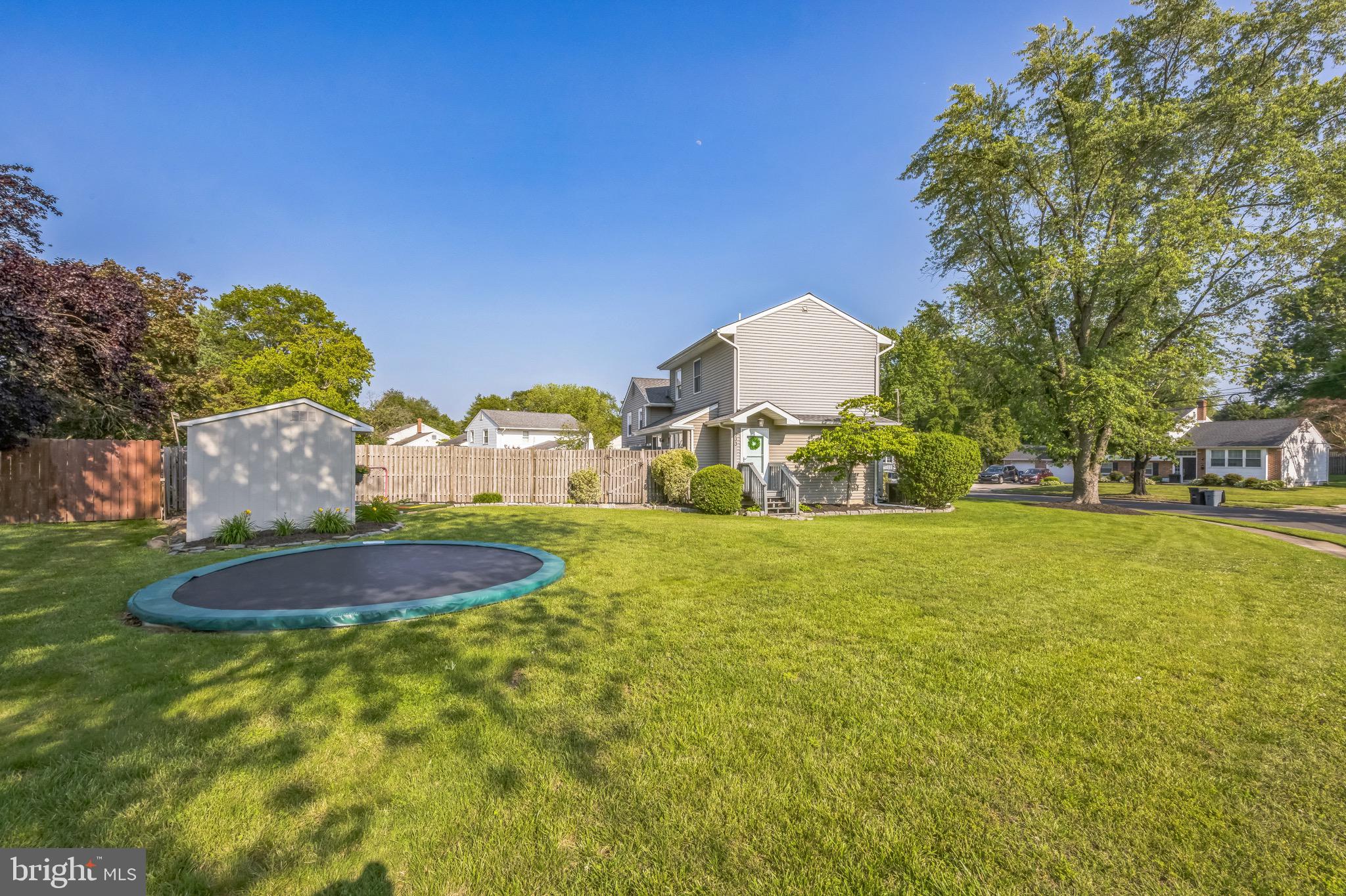333 Farmdale Road Moorestown, NJ 08057 - Photo 4 of 45 a swimming pool with outdoor seating and yard