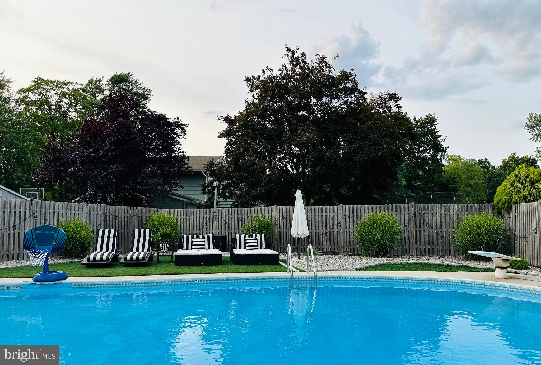 333 Farmdale Road Moorestown, NJ 08057 - Photo 43 of 45 a view of a swimming pool with a table and chairs