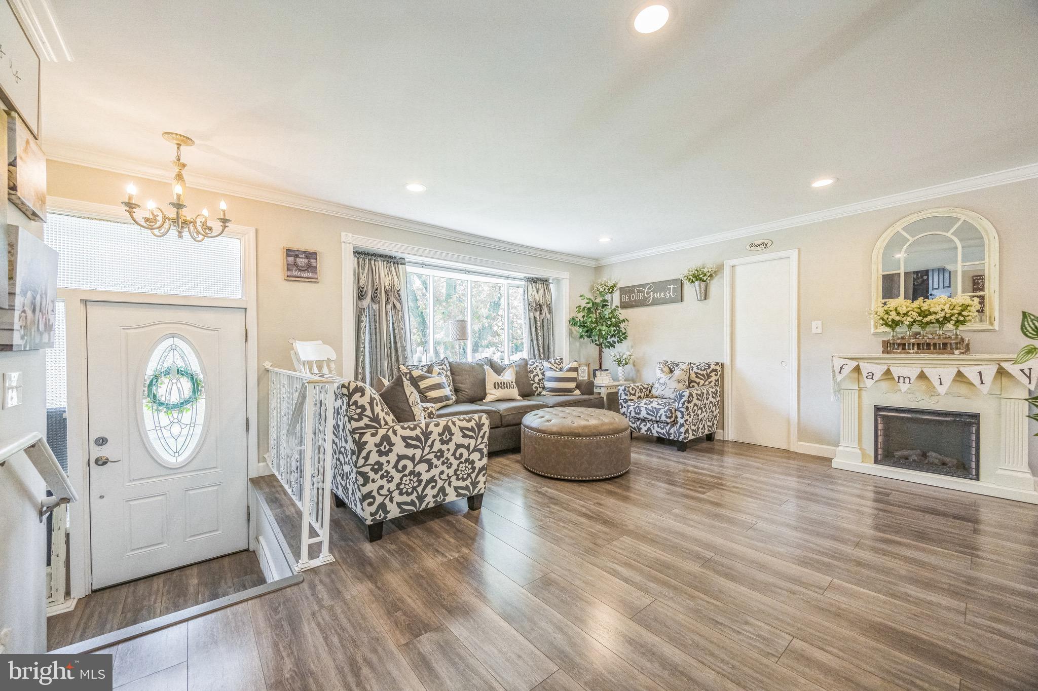 333 Farmdale Road Moorestown, NJ 08057 - Photo 5 of 45 a living room with furniture and a fireplace