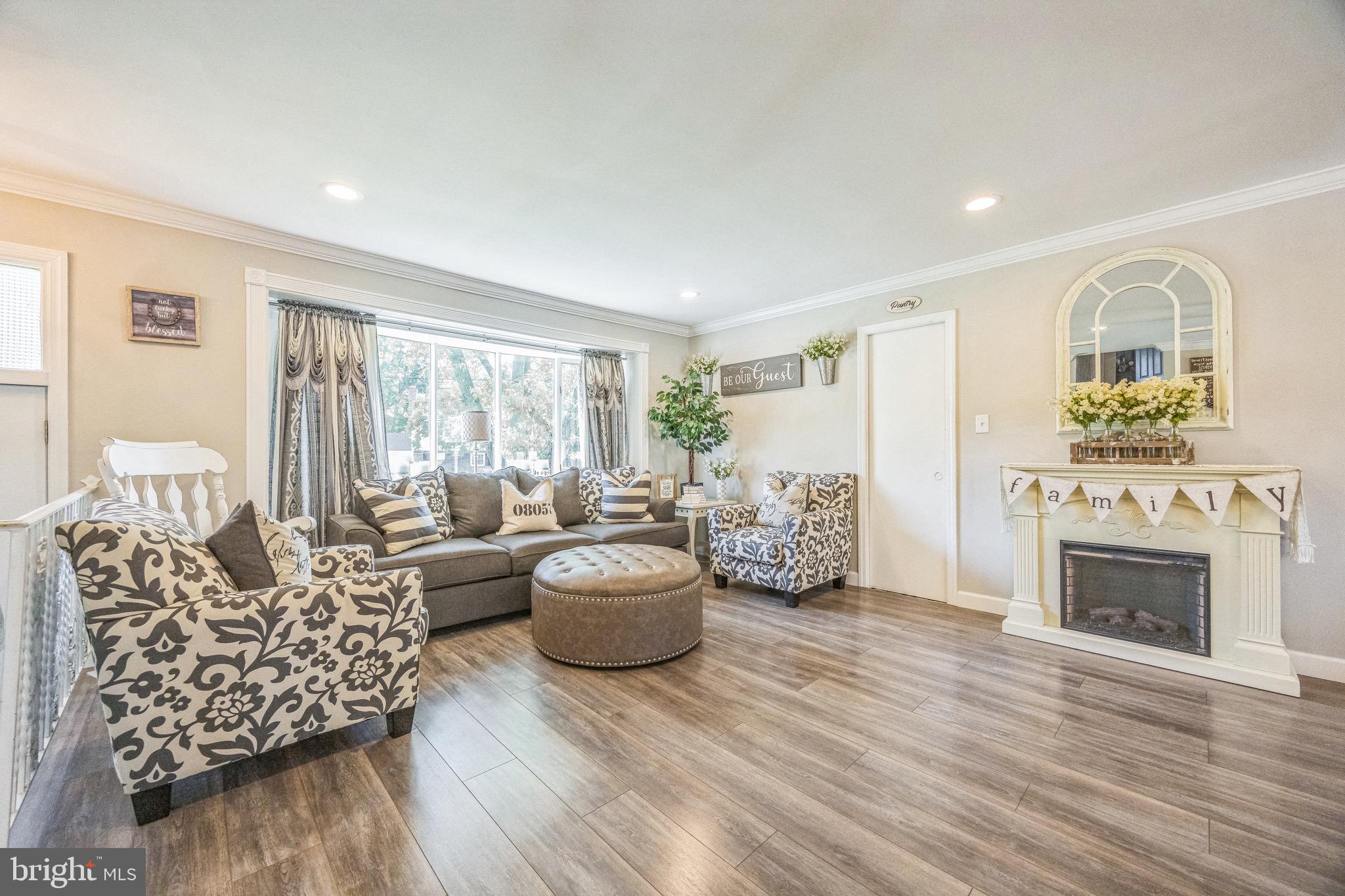 333 Farmdale Road Moorestown, NJ 08057 - Photo 6 of 45 a living room with furniture and a fireplace
