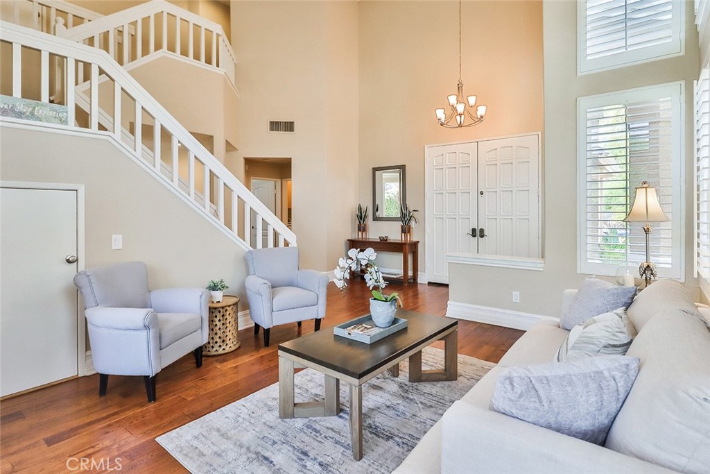 5205 Pesto Way Oak Park, CA 91377 - Photo 11 of 71 a living room with furniture a table and a chandelier