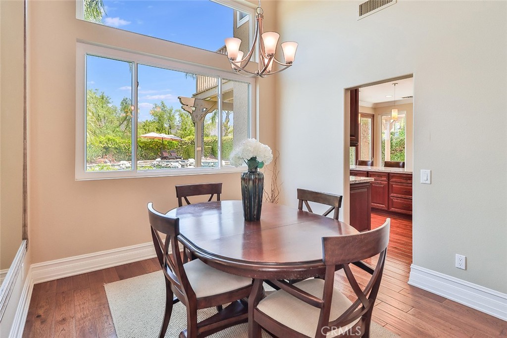 5205 Pesto Way Oak Park, CA 91377 - Photo 14 of 71 a view of a dining room with furniture window and wooden floor