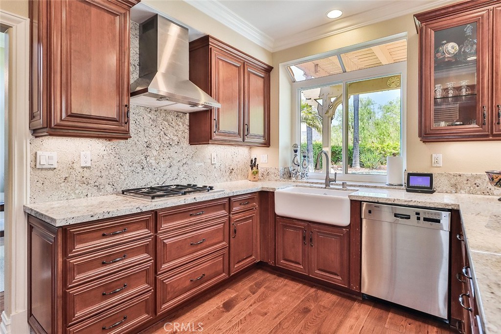 5205 Pesto Way Oak Park, CA 91377 - Photo 20 of 71 a kitchen with a sink stove and cabinets