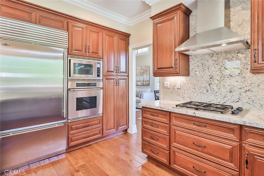 5205 Pesto Way Oak Park, CA 91377 - Photo 25 of 71 a kitchen with granite countertop a stove microwave and cabinets