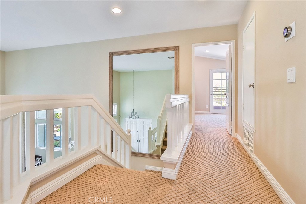 5205 Pesto Way Oak Park, CA 91377 - Photo 33 of 71 a view of a hallway with wooden floor and staircase