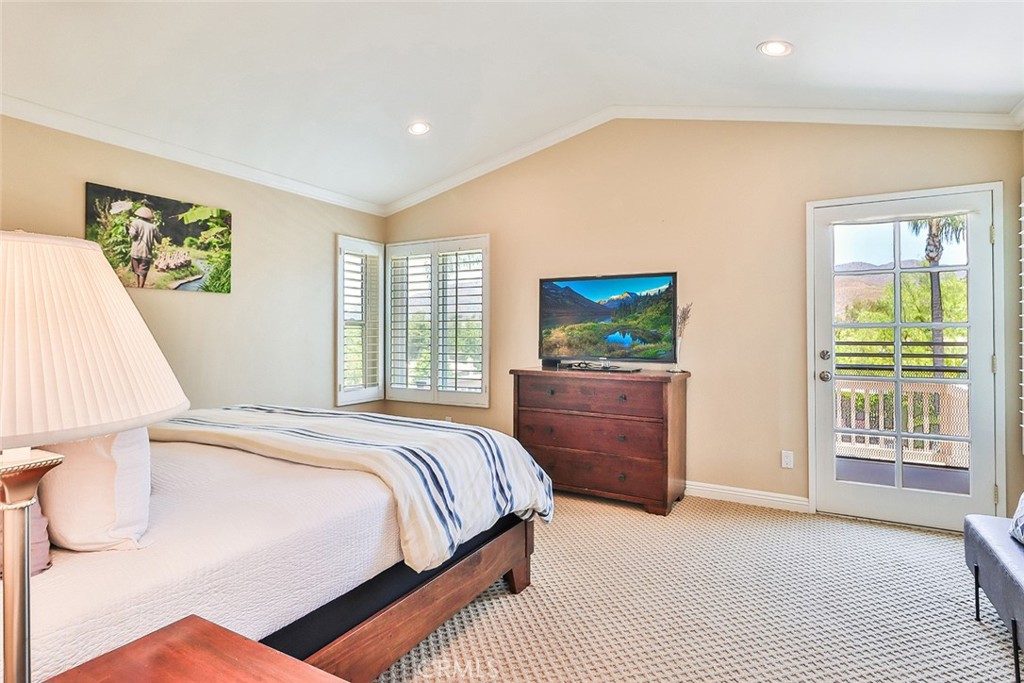 5205 Pesto Way Oak Park, CA 91377 - Photo 34 of 71 a bedroom with a bed and a dresser next to a window