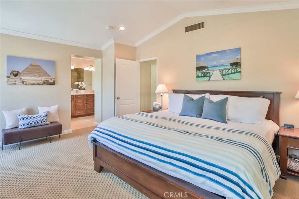 5205 Pesto Way Oak Park, CA 91377 - Photo 35 of 71 a bedroom with bed and a painting on the wall
