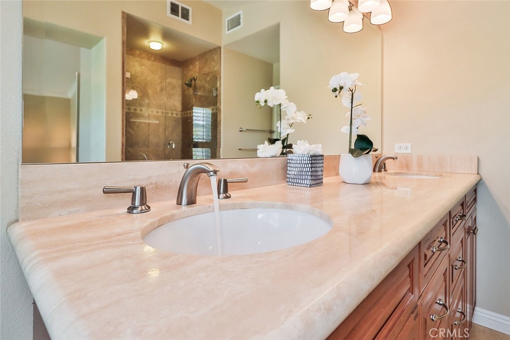 5205 Pesto Way Oak Park, CA 91377 - Photo 38 of 71 a bathroom with a double vanity sink and a mirror