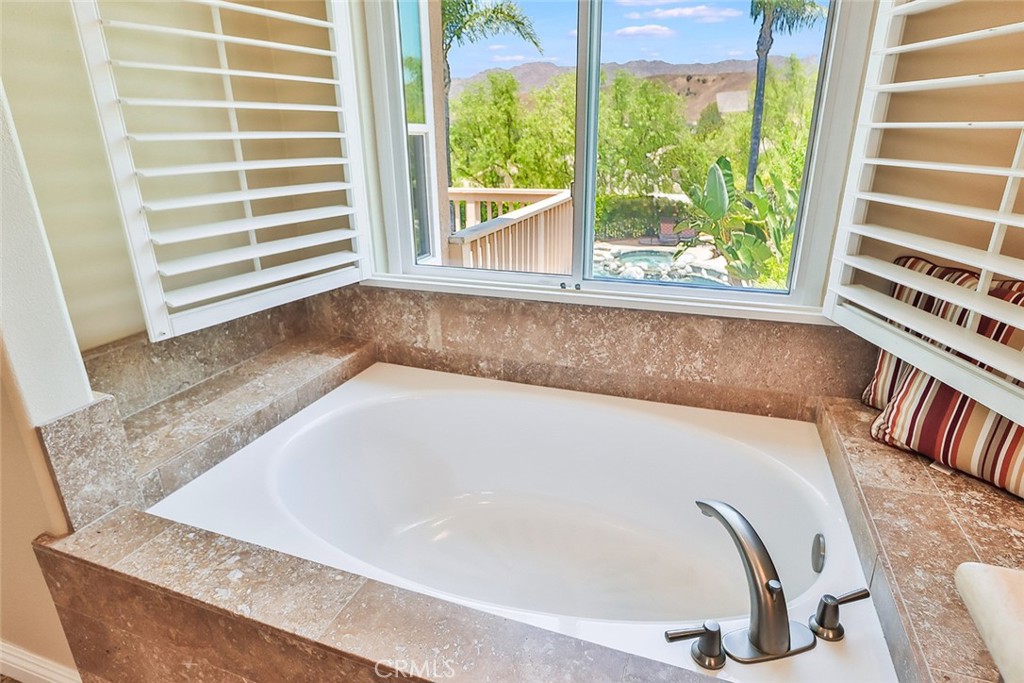 5205 Pesto Way Oak Park, CA 91377 - Photo 40 of 71 a bath tub sitting in front of a window