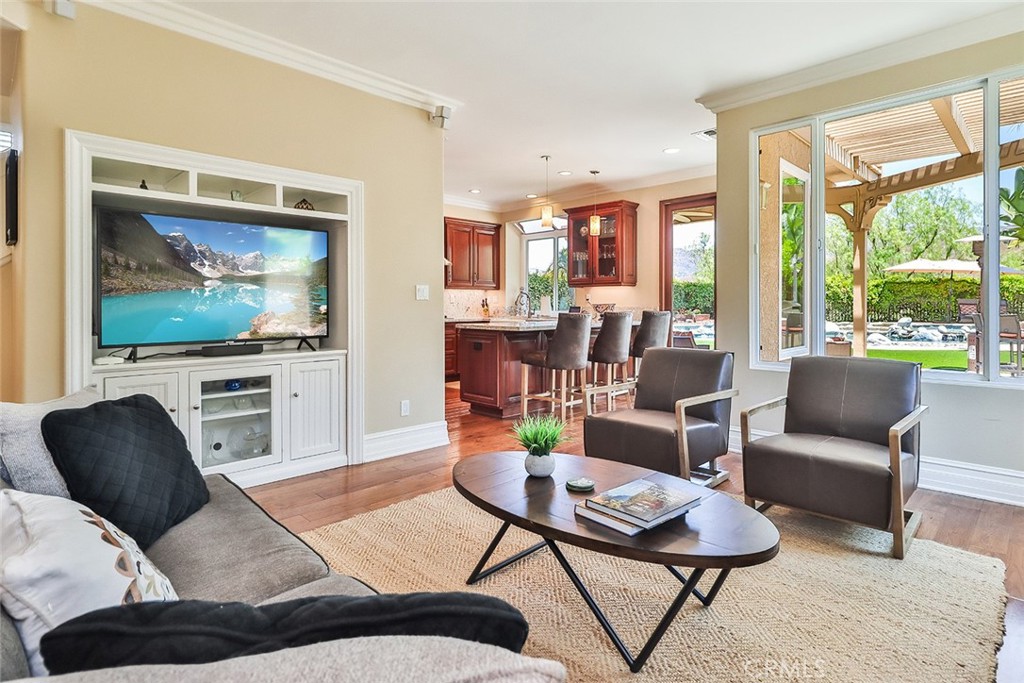 5205 Pesto Way Oak Park, CA 91377 - Photo 4 of 71 a living room with furniture and a flat screen tv