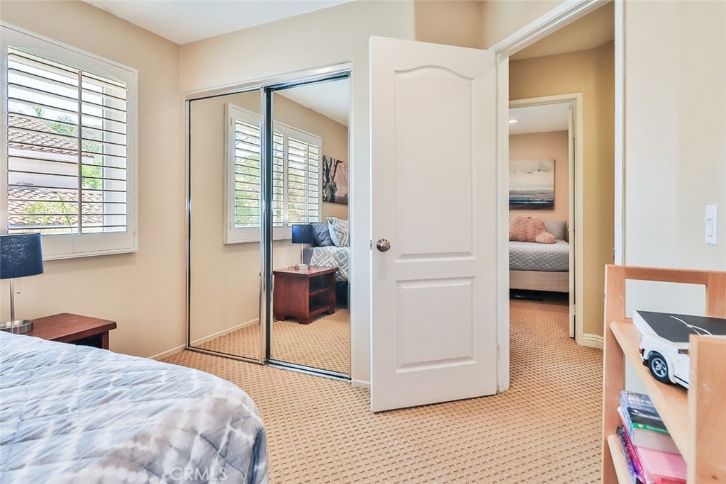 5205 Pesto Way Oak Park, CA 91377 - Photo 49 of 71 a bedroom with a bed and a cabinets