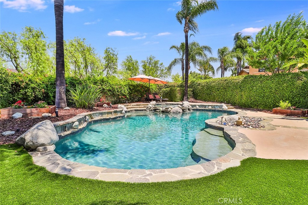 5205 Pesto Way Oak Park, CA 91377 - Photo 56 of 71 a view of a swimming pool with a yard