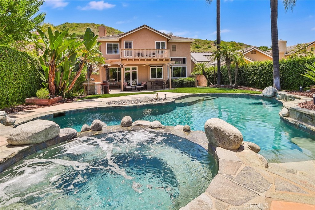 5205 Pesto Way Oak Park, CA 91377 - Photo 60 of 71 a view of a house with pool and chairs