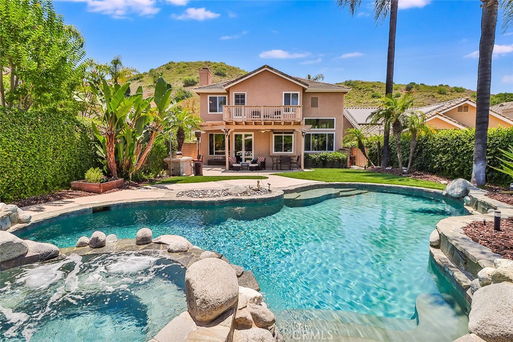 5205 Pesto Way Oak Park, CA 91377 - Photo 61 of 71 a view of a house with swimming pool yard and outdoor seating