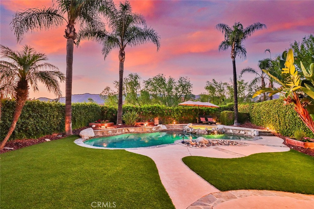 5205 Pesto Way Oak Park, CA 91377 - Photo 63 of 71 a view of a backyard with a garden and palm trees