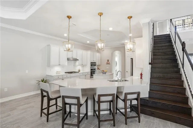 a kitchen with a sink stove and refrigerator