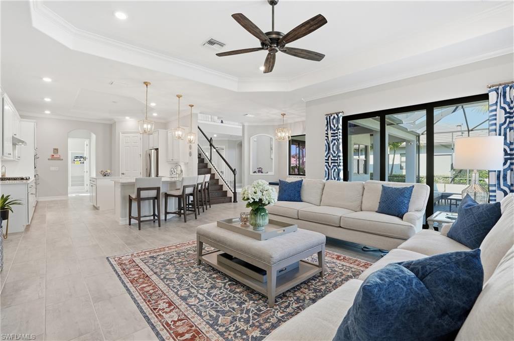 2235 Somerset Place Naples, FL 34120 - Photo 14 of 49 a living room with furniture and a large window