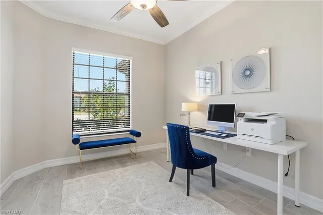 a view of a dining room with furniture and a chandelier