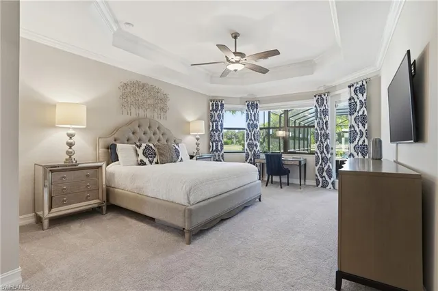 a bedroom with a bed and a flat tv screen