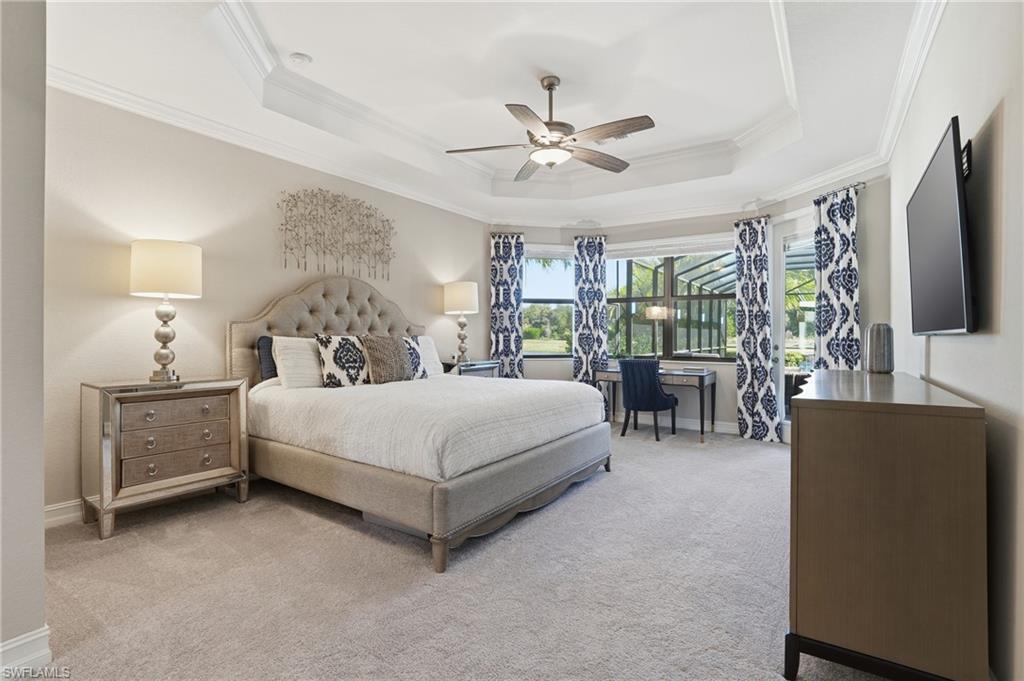 2235 Somerset Place Naples, FL 34120 - Photo 20 of 49 a bedroom with a bed and a flat tv screen