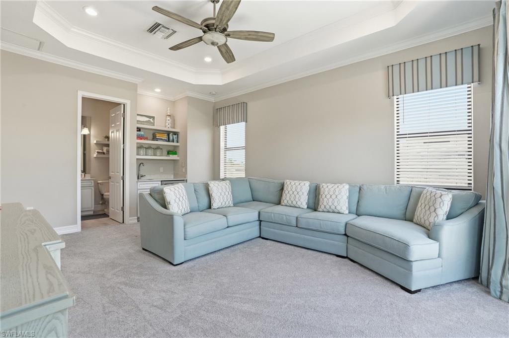 2235 Somerset Place Naples, FL 34120 - Photo 27 of 49 a living room with furniture and a window
