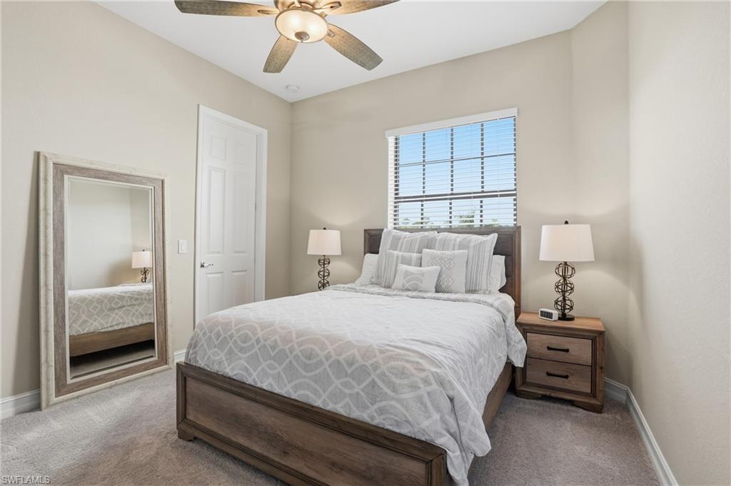 2235 Somerset Place Naples, FL 34120 - Photo 28 of 49 a bedroom with a bed and a window