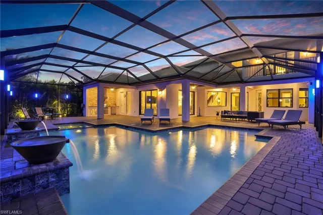 a view of swimming pool with sitting area