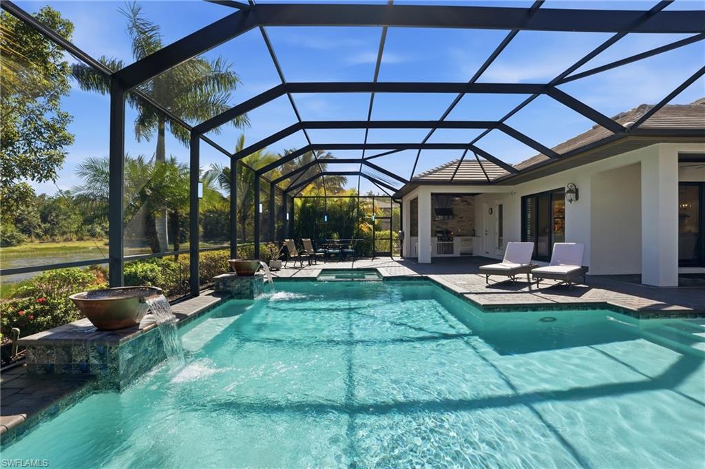 2235 Somerset Place Naples, FL 34120 - Photo 31 of 49 a view of a backyard with sitting area and furniture