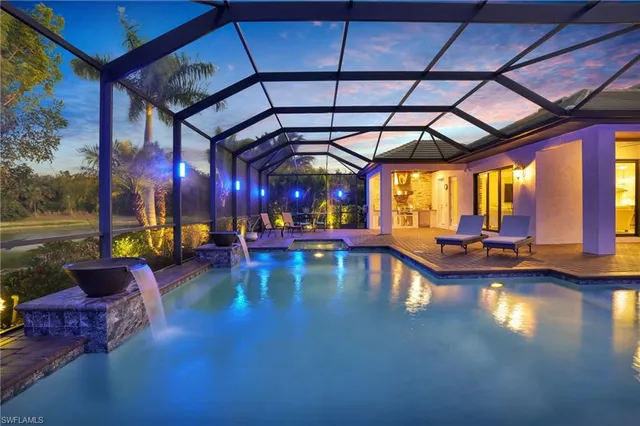 a view of swimming pool with outdoor seating