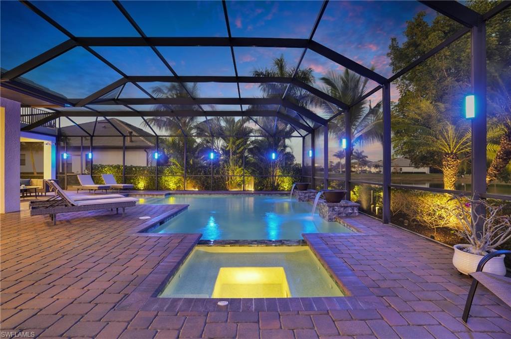 2235 Somerset Place Naples, FL 34120 - Photo 36 of 49 a view of a swimming pool with a patio