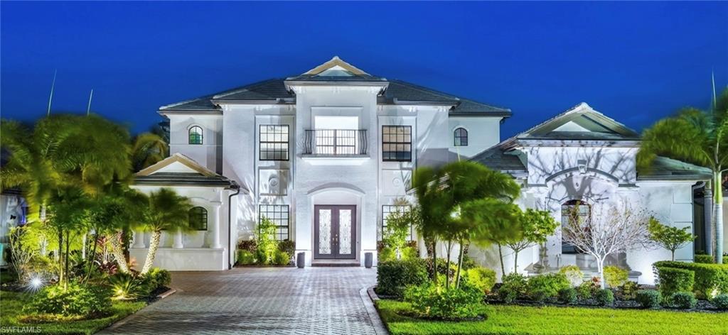 2235 Somerset Place Naples, FL 34120 - Photo 37 of 49 a front view of a house with garden