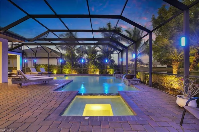 a view of a swimming pool with a patio